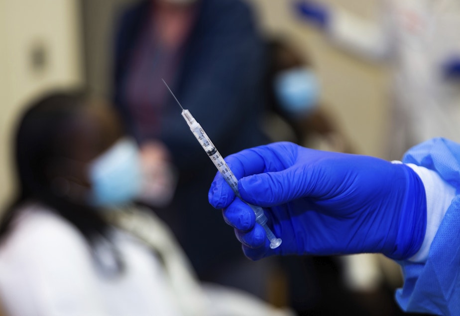 caption: A doctor prepares to administer a vaccine injection at New York-Presbyterian Lawrence Hospital in Bronxville, N.Y., in January. The FDA has approved emergency use authorization of the Pfizer/BioNTech vaccine for patients age 12-15.