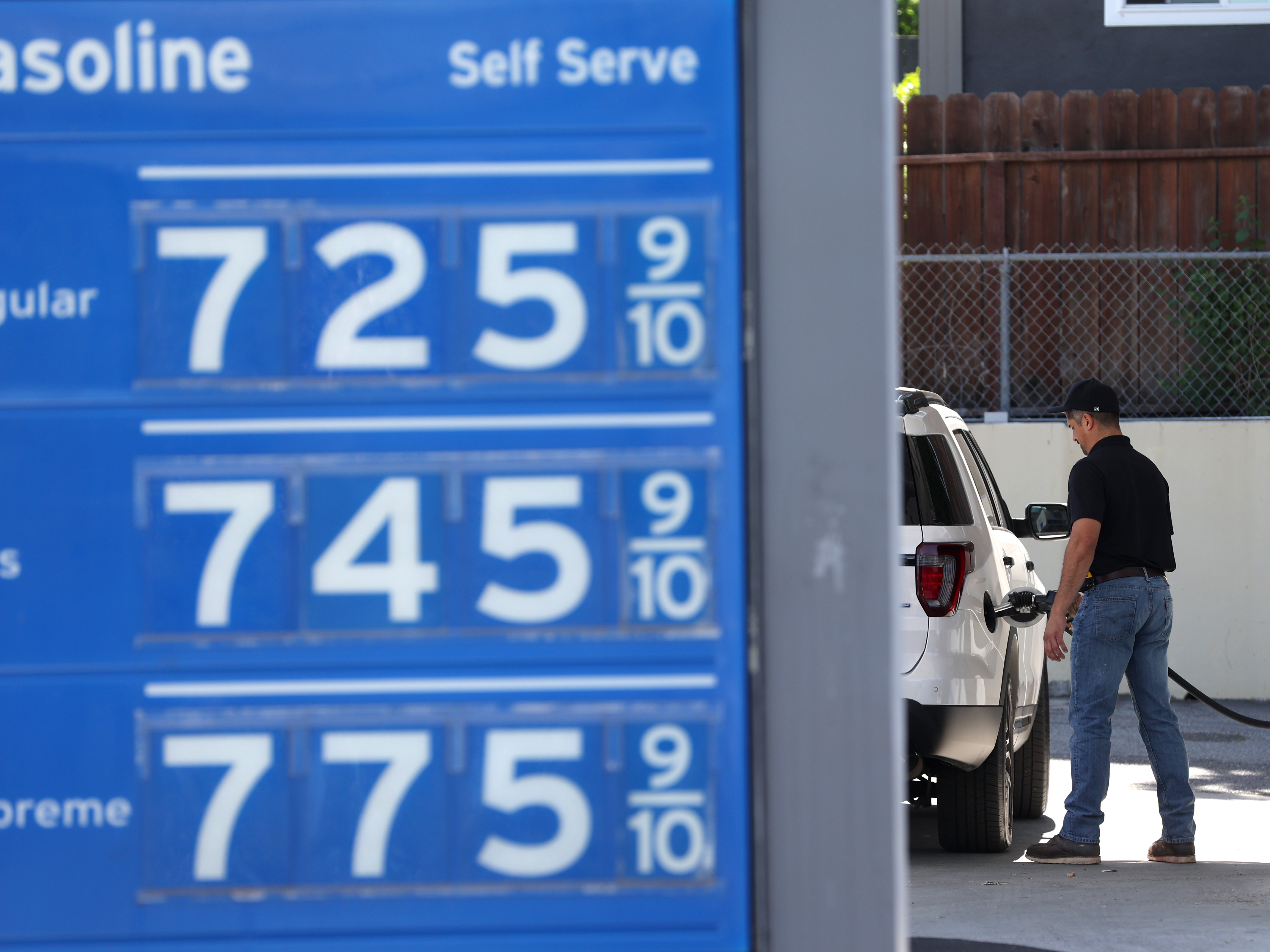caption: Gas prices over $7.00 a gallon are displayed at a Chevron gas station in Menlo Park, Calif., on May 25.