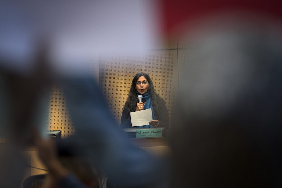 caption: FILE: Councilmember Kshama Sawant votes no to councilmember Lorena Gonzalez's nomination of Tim Burgess to become the interim mayor of Seattle, on Monday, September 18, 2017, at City Hall in Seattle. 