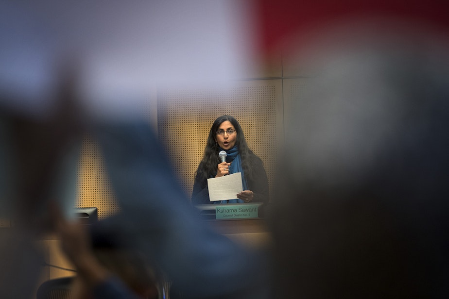 caption: FILE: Councilmember Kshama Sawant votes no to councilmember Lorena Gonzalez's nomination of Tim Burgess to become the interim mayor of Seattle, on Monday, September 18, 2017, at City Hall in Seattle.