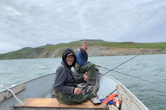 caption: Ethan Lincoln, 17, fishes for king salmon and red salmon with his cousin Avery Tulik in the Kangirlvar Bay, Alaska.