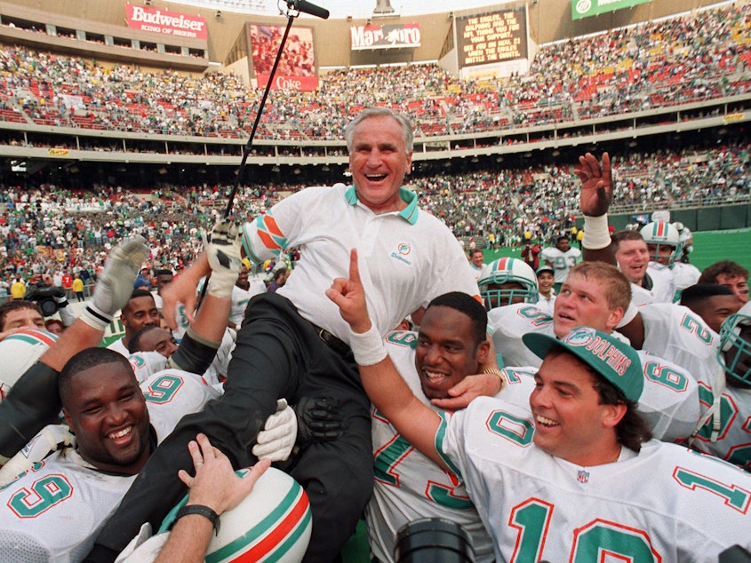 caption: Miami Dolphins coach Don Shula is carried on his team's shoulders in 1993 after his 325th victory, against the Philadelphia Eagles in Philadelphia.