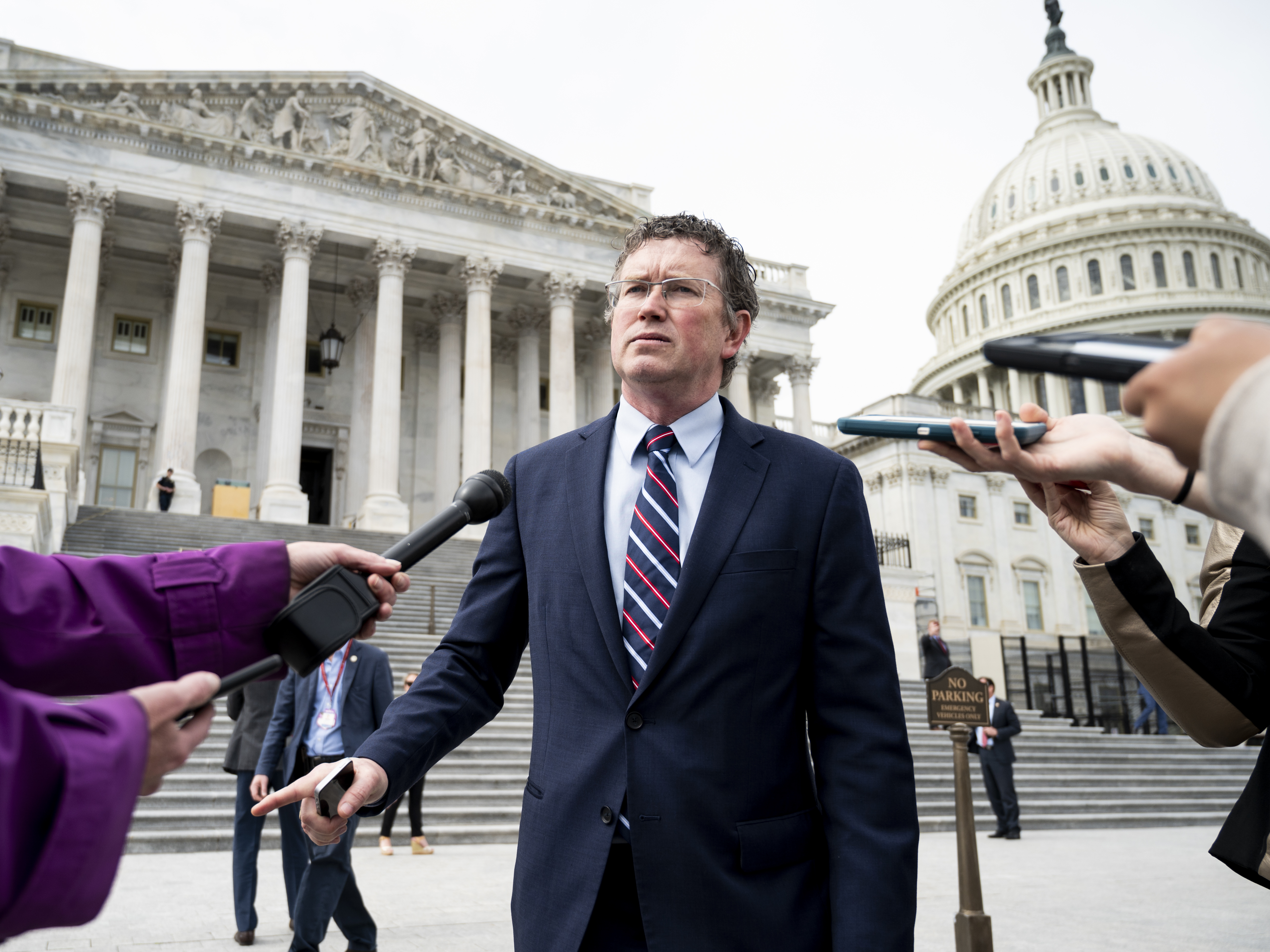 caption: Rep. Thomas Massie, (R-Ky.) at the Capitol Friday after trying to force a recorded vote on the $2 trillion coronavirus relief bill. Massie and other libertarians worry the bill will ruin the United States' creditworthiness.