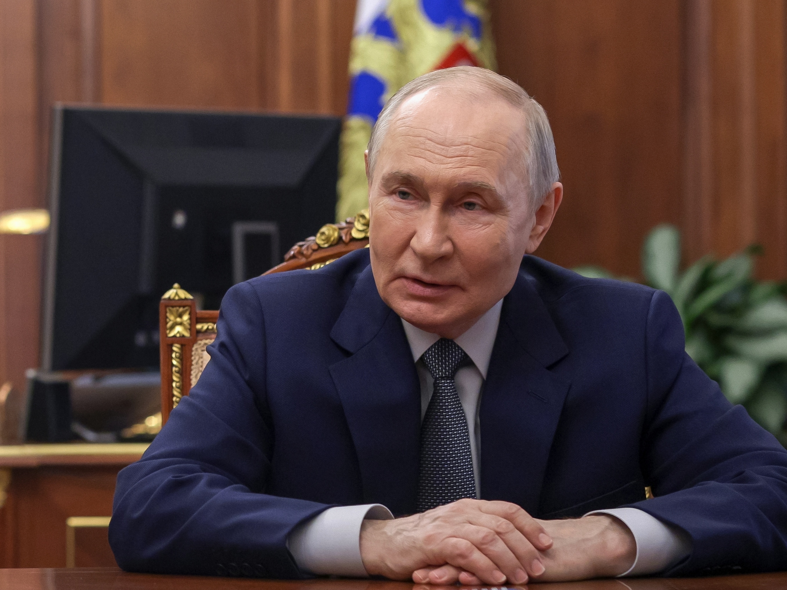 caption: Russian President Vladimir Putin listens to Head of the Republic of Mordovia Artyom Zdunov at the Kremlin in Moscow, Monday, May 4, 2026.
