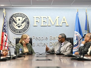 caption: FEMA Administrator Deanne Criswell (left) along with NAACP President & CEO Derrick Johnson (right) signed an agreement this week outlining ways in which the two organizations will work together to center equity in disaster preparedness and response efforts.