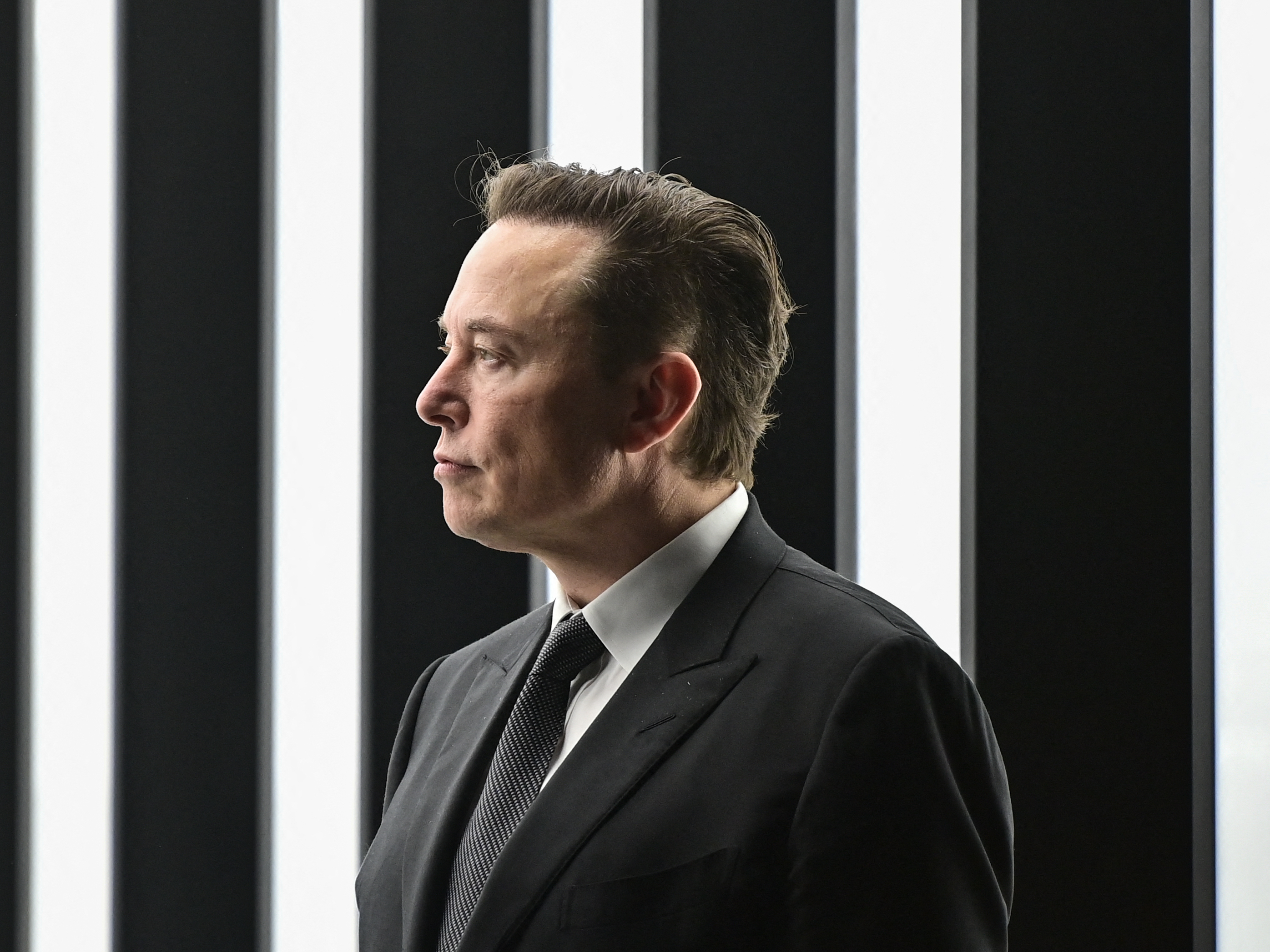 caption: Tesla CEO Elon Musk is pictured as he attends the start of production at Tesla's "Gigafactory" in Gruenheide, southeast of Berlin in Germany. on March 22, 2022. Tesla held an investor day on Wednesday. It did not reveal a new vehicle, but it unveiled some of its big-picture ideas on climate change.