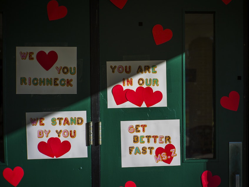 caption: Messages of support for teacher Abby Zwerner, who was shot by a 6-year-old student, grace the front door of Richneck Elementary School Newport News, Va. on Jan. 9, 2023. Zwerner said Monday, March 20, that she has had four surgeries and has gone through a challenging recovery.