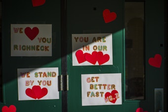 caption: Messages of support for teacher Abby Zwerner, who was shot by a 6-year-old student, grace the front door of Richneck Elementary School Newport News, Va. on Jan. 9, 2023. Zwerner said Monday, March 20, that she has had four surgeries and has gone through a challenging recovery.