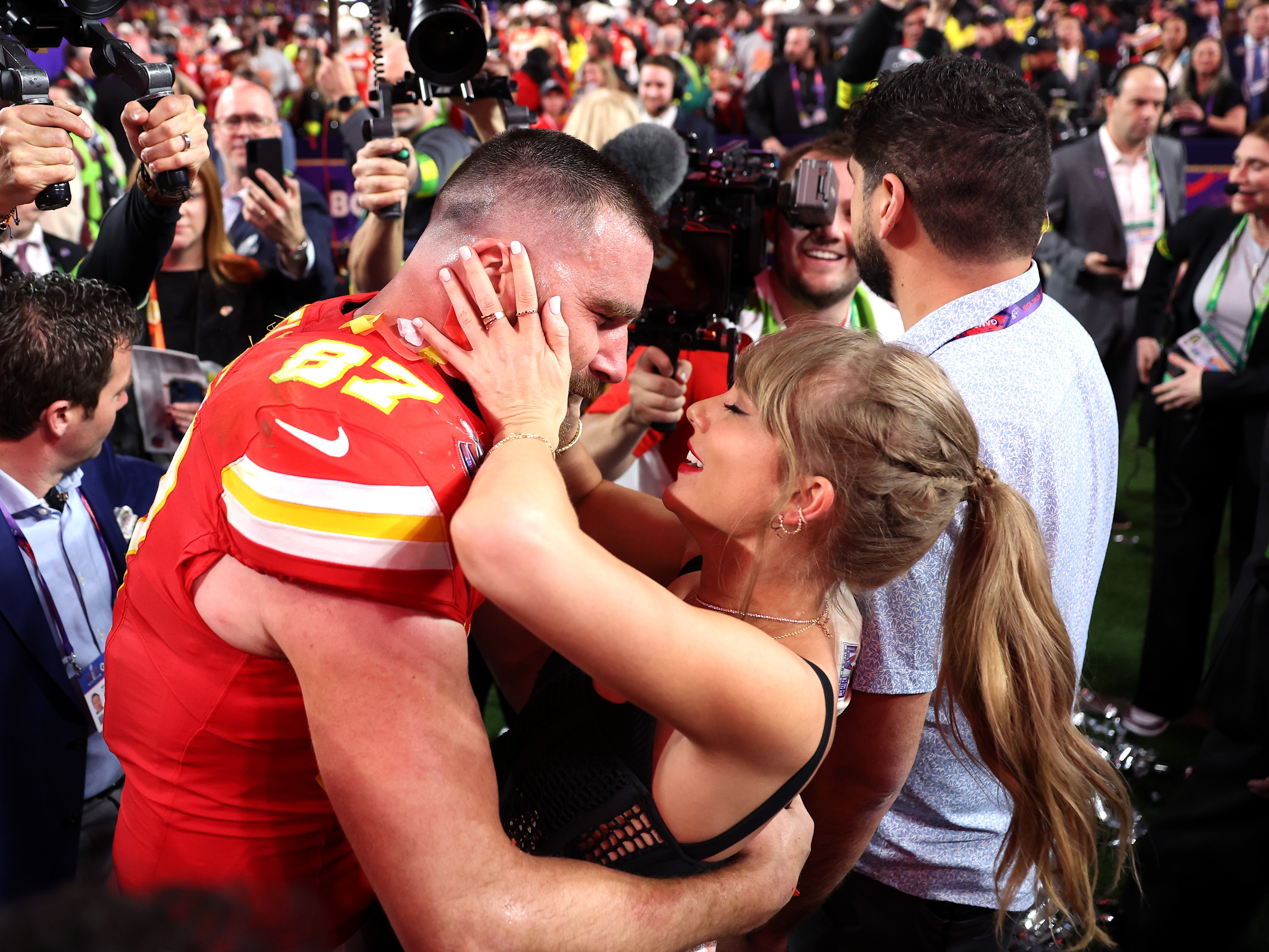 caption: Travis Kelce and Taylor Swift celebrated publicly after the Kansas City Chiefs won the 2024 Super Bowl. They announced their engagement on Tuesday.