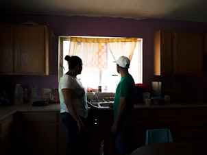 caption: Tania and her husband, Joseph, initially had to stay just across the border in Mexico under a Trump administration program that requires thousands of people to wait in northern Mexico cities while their immigration cases are heard in U.S. courts.
