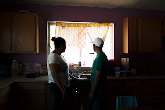 caption: Tania and her husband, Joseph, initially had to stay just across the border in Mexico under a Trump administration program that requires thousands of people to wait in northern Mexico cities while their immigration cases are heard in U.S. courts.