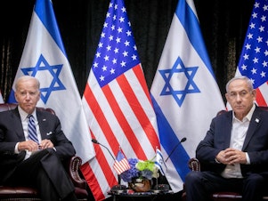 caption: President Biden sits with Israeli Prime Minister Benjamin Netanyahu, at the start of the Israeli war cabinet meeting, in Tel Aviv on Oct. 18, 2023.