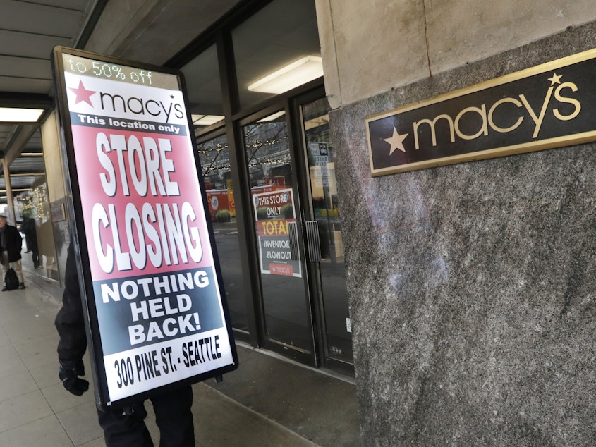 caption: Macy's is cutting 2,000 jobs and closing about 125 stores, such as this one in Seattle, the company announced Tuesday.