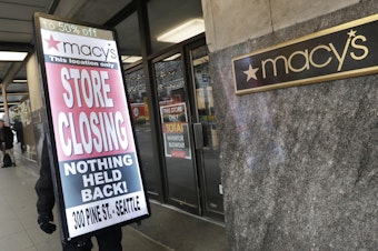 caption: Macy's is cutting 2,000 jobs and closing about 125 stores, such as this one in Seattle, the company announced Tuesday.