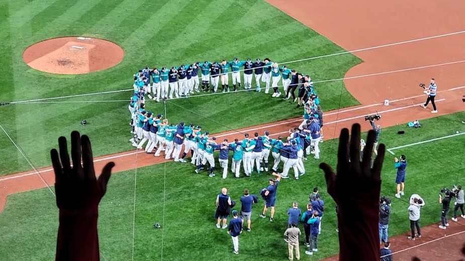 caption: Fans celebrate the Mariners playoff berth at T-Mobile Park on Friday, September 30, 2022.