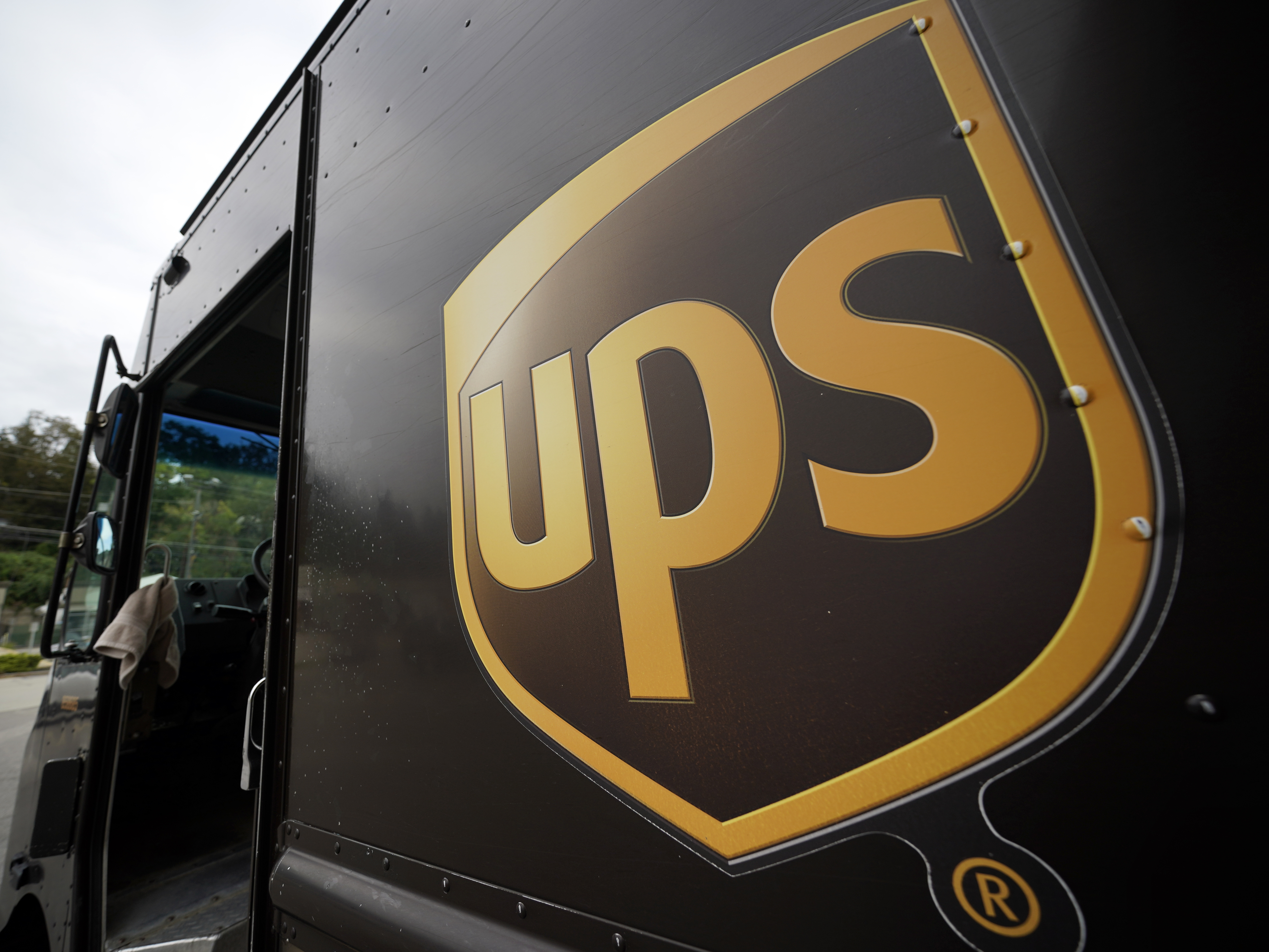 caption: UPS plans to hire more than 100,000 extra workers to help handle an increase in packages during the critical holiday season. That's similar to the holiday seasons of 2021 and 2020.