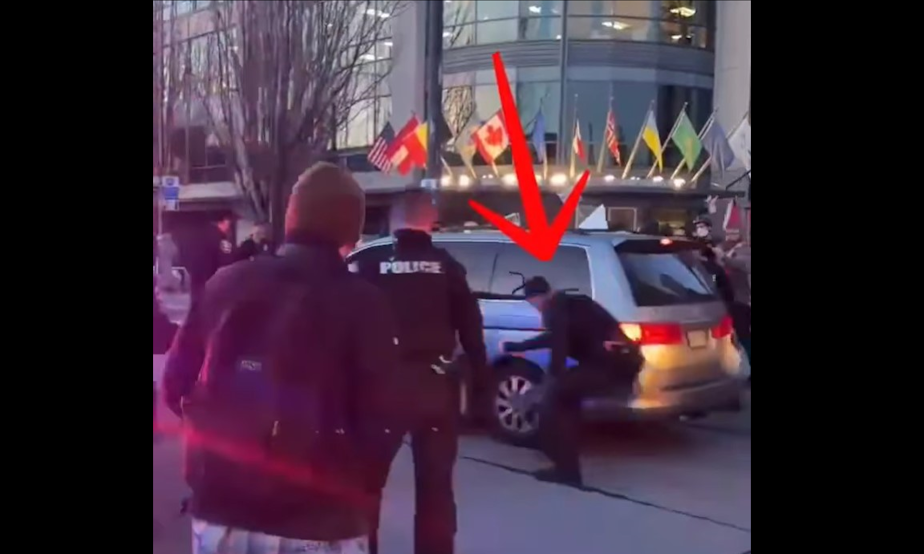 caption: A video on Instagram shows what appears to be a Seattle officer deflating the tire during a march last month.