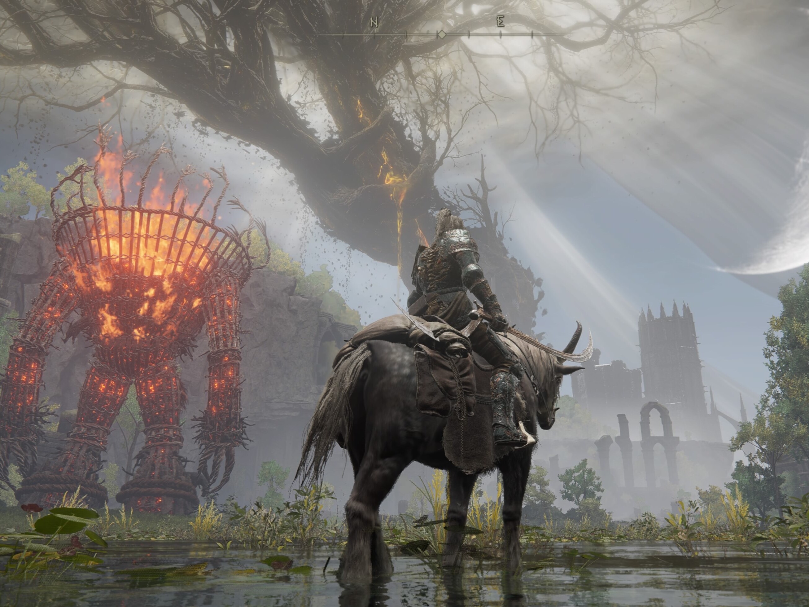 caption:  The Scadutree towers over The Land of Shadow, a photonegative of the Erdtree in The Lands Between. 