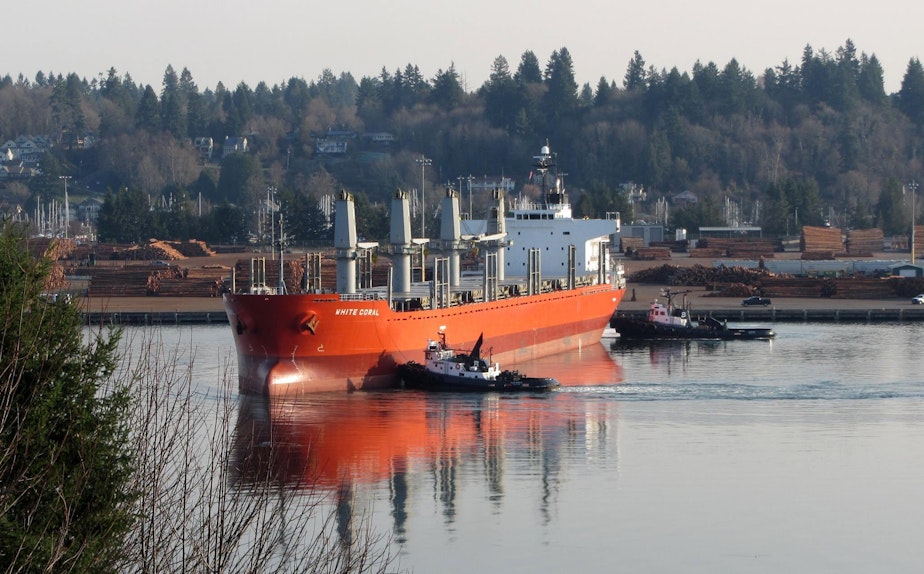 caption: The Port of Olympia does a steady business exporting logs to China and Japan for Weyerhaeuser. Wood is now hit by a retaliatory tariff.