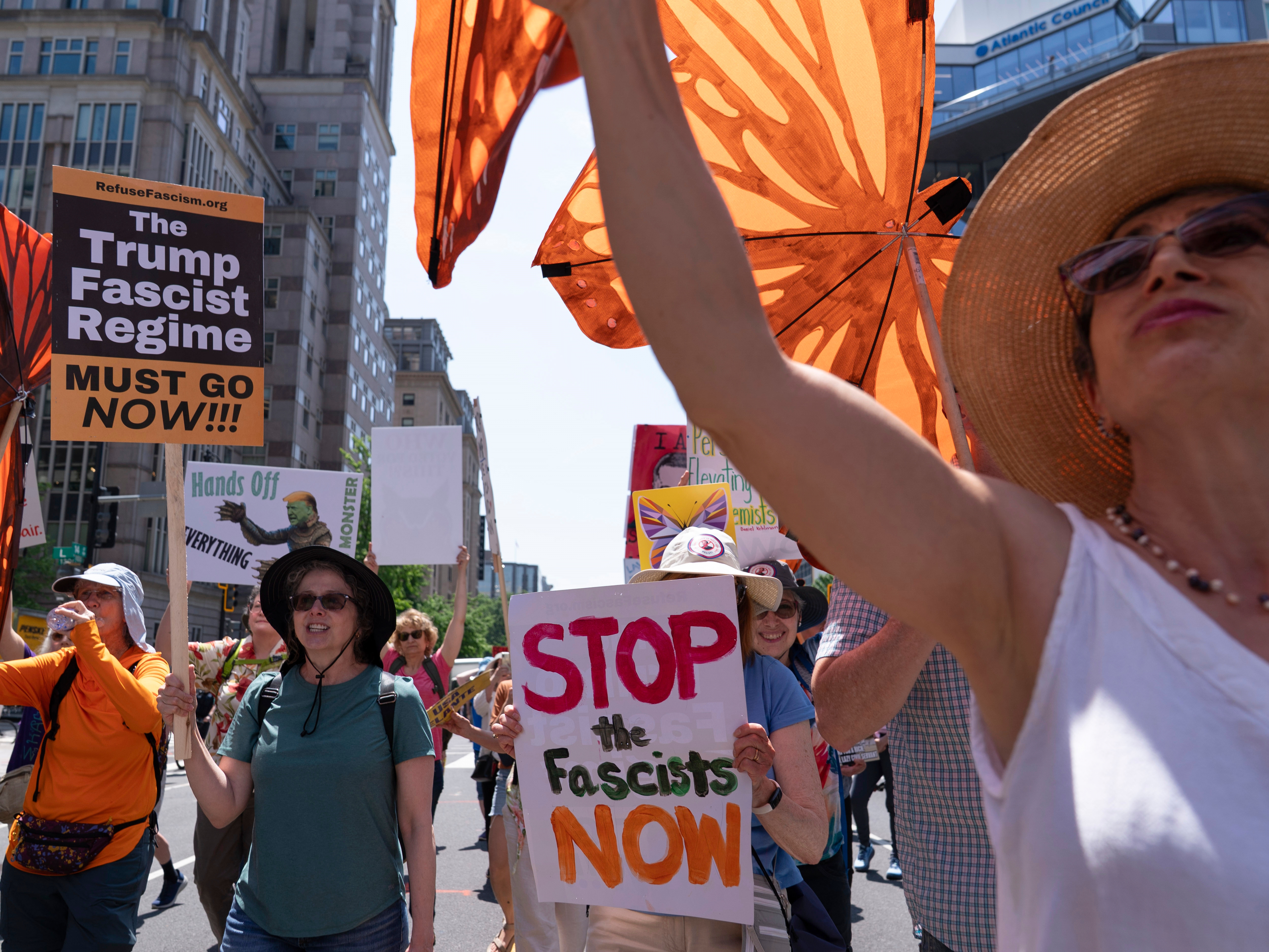caption: Demonstrators march to the White House during a May Day protest in Washington, D.C., on May 1, 2025.