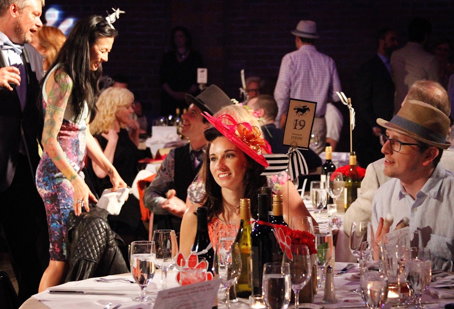 caption: Revelers at the McGilvra Elementary School Spring Auction on April 23, 2016. The auction brought in much of the $422,000 the school raised last year.