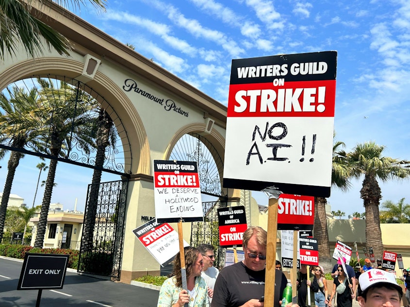 caption: Hollywood writers picket outside of Paramount Pictures this week.