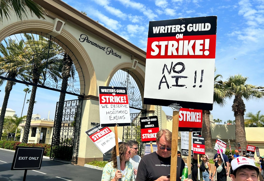 caption: Hollywood writers picket outside of Paramount Pictures this week.