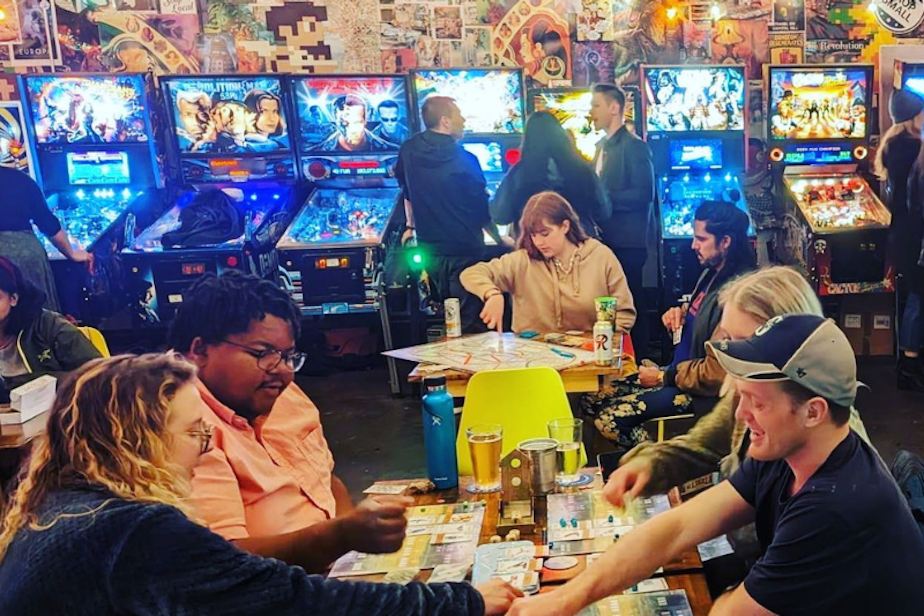 caption: The Raygun Lounge in Seattle's Capitol Hill neighborhood is a board game pub and pinball hub. 