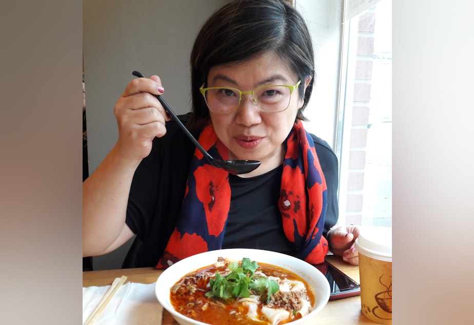caption: Food writer Hsiao-Ching Chou enjoying her noodle soup at Xi'An Noodles.