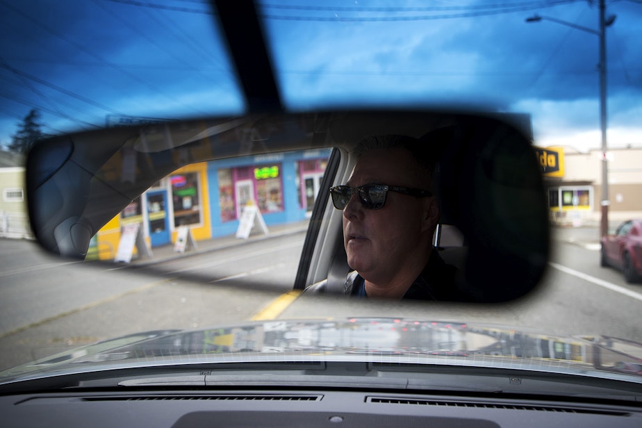 caption: Sgt. Tom Umporowicz drives along Aurora Avenue North on Wednesday, March 28, 2018, in Seattle.