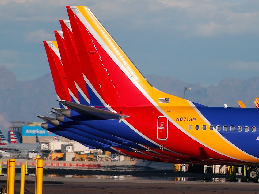 caption: Southwest Airlines Boeing 737 Max aircraft sit on the tarmac at Phoenix Sky Harbor International Airport on March 13. The 737 Max has been grounded worldwide following a pair of deadly crashes.