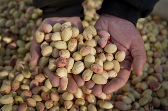 caption: California is the top nut grower in the U.S. The booming industry that has attracted organized agricultural crime rings. (AP Photo/Justin Kase Conder)