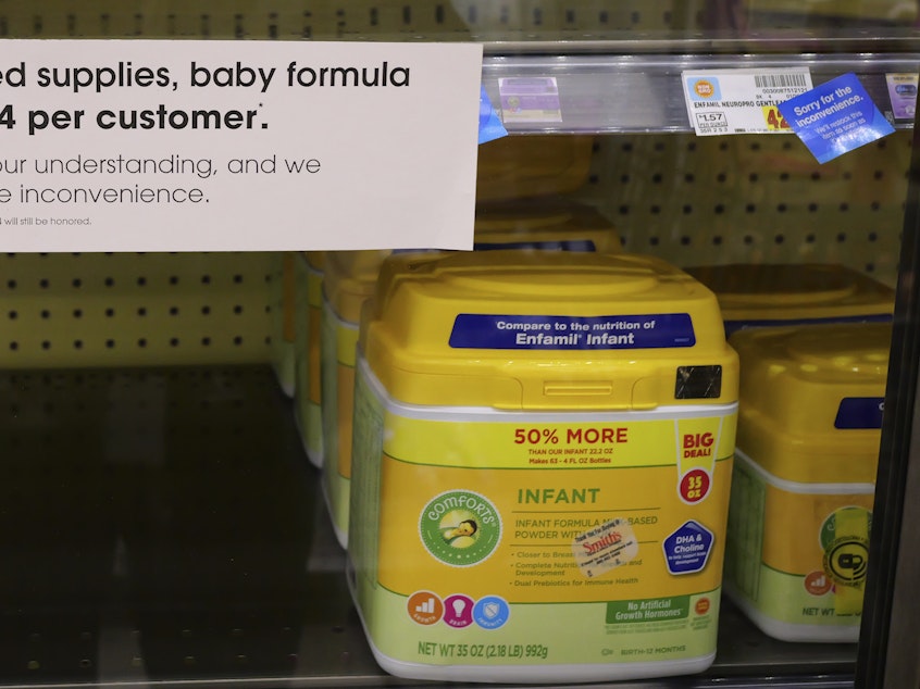 caption: A sign tells customers of limited supplies of baby formula at a grocery store in Salt Lake City on Tuesday.