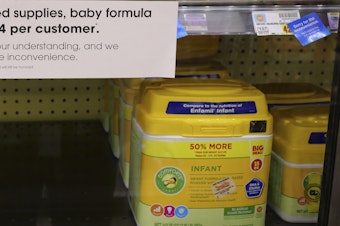 caption: A sign tells customers of limited supplies of baby formula at a grocery store in Salt Lake City on Tuesday.