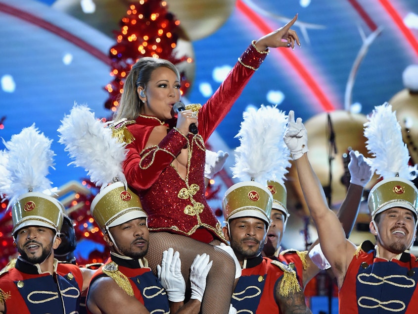 caption: Mariah Carey performs onstage during 2016 VH1's Divas Holiday: Unsilent Night at Kings Theatre on December 2, 2016 in New York.