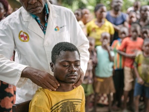 caption: Alexis Mukwedi tested positive for sleeping sickness during a two-day mobile screening in the Democratic Republic of the Congo. He had complained about nervous tics and fatigue.