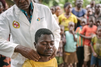 caption: Alexis Mukwedi tested positive for sleeping sickness during a two-day mobile screening in the Democratic Republic of the Congo. He had complained about nervous tics and fatigue.