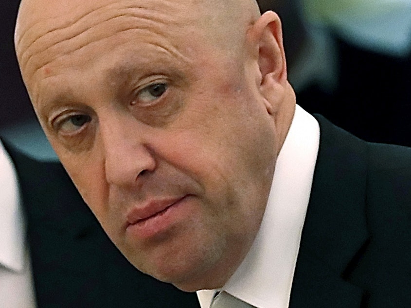 caption: Russian businessman Yevgeny Prigozhin is shown prior to a meeting of Russian President Vladimir Putin and Chinese President Xi Jinping in the Kremlin in Moscow, Russia, on Tuesday, July 4, 2017. Prigozhin, an entrepreneur known as "Putin's chef" because of his catering contracts with the Kremlin, has admitted he interfered in U.S. elections and says he will continue to do so.
