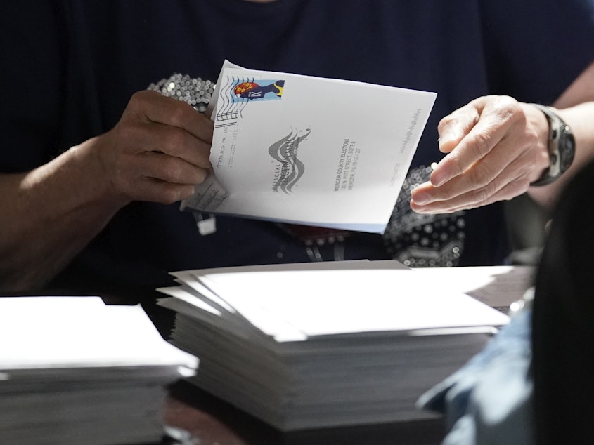 caption: An election worker continues the process of counting ballots for the 2022 Pennsylvania primary election in Mercer, Pa.
