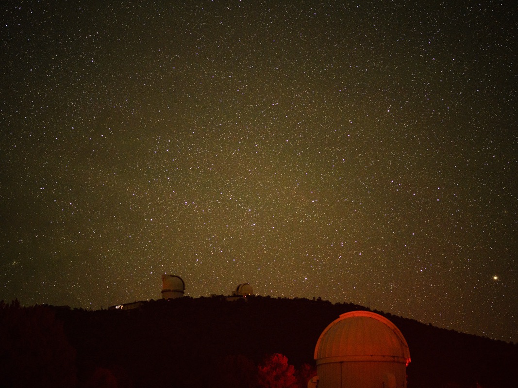 caption: The night sky looms bright over the facilities of McDonald Observatory after a Star Party in Fort Davis, Texas on Tuesday, May 27, 2025.