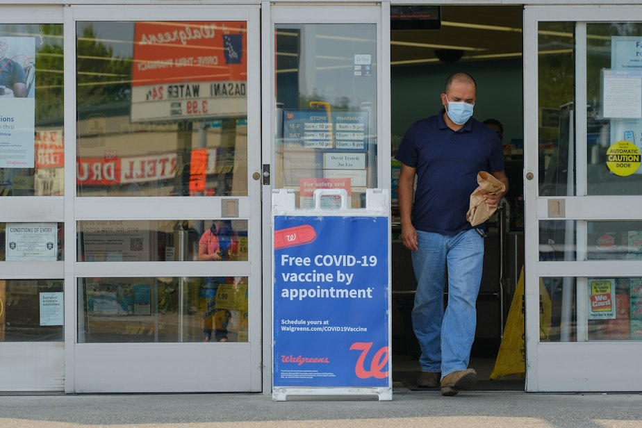caption: Walgreens advertises free Covid-19 testing outside their Southwest Roxbury location, August 3, 2021.