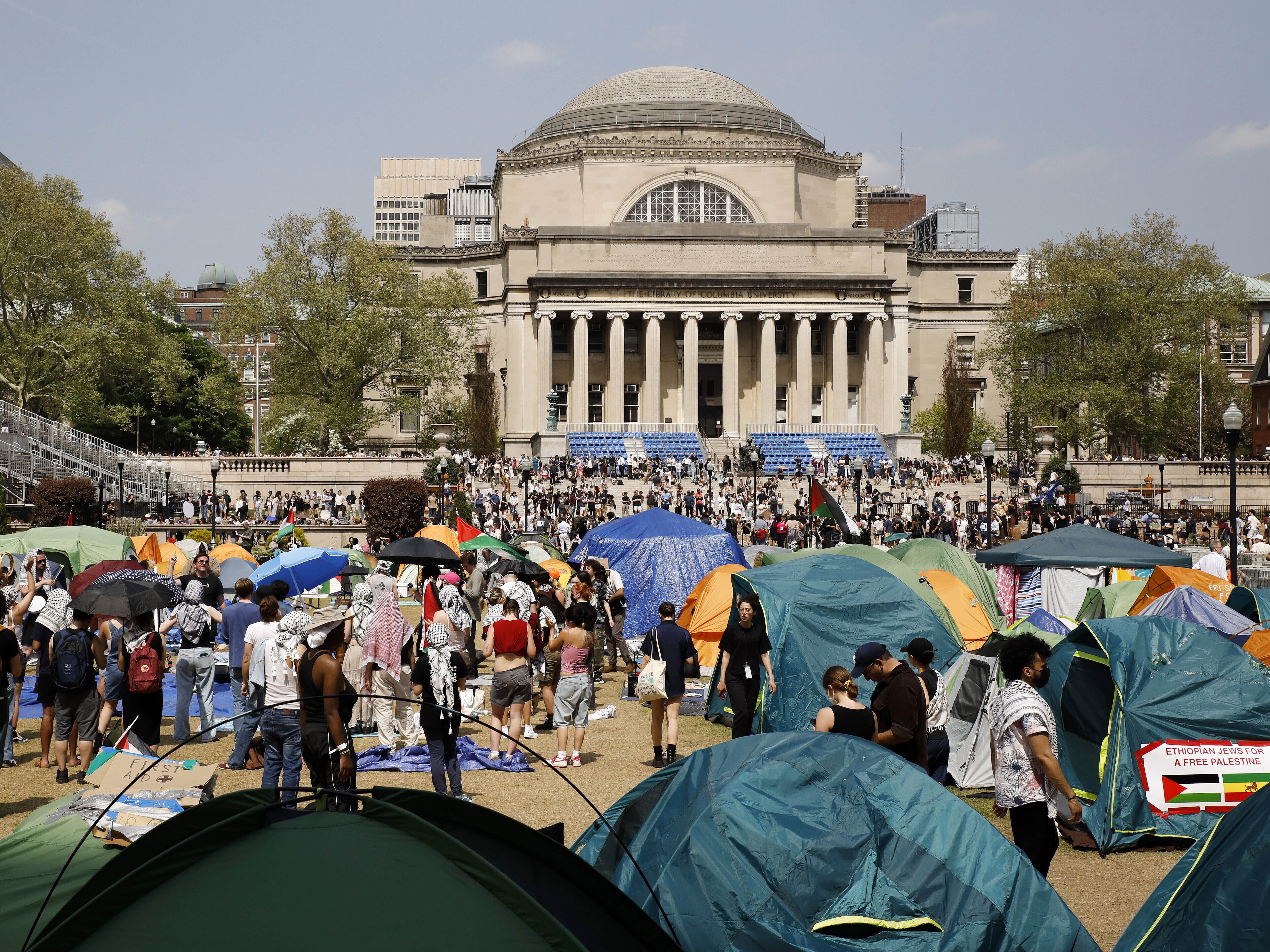 caption: Student protesters gather inside their encampment on the Columbia University campus in New York on April 29, 2024.