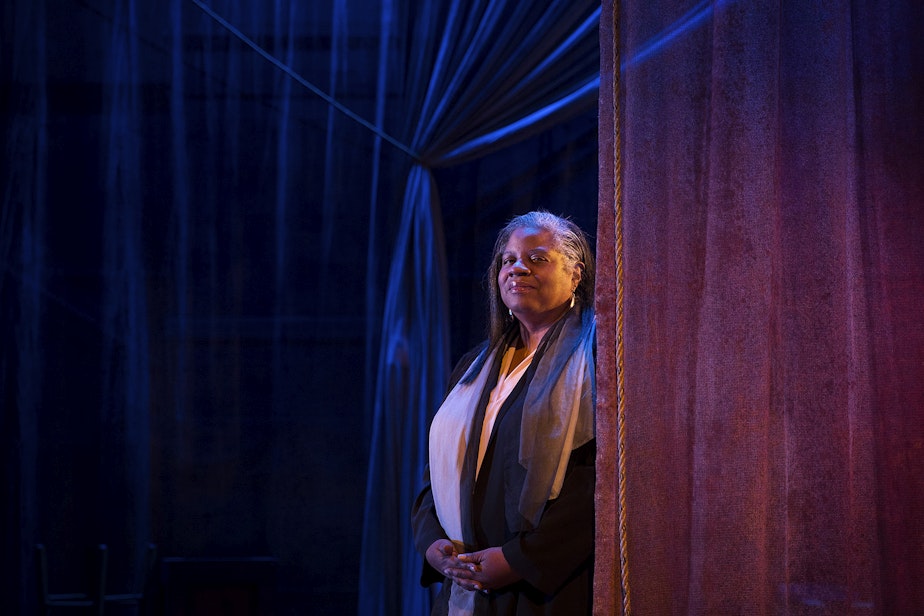 caption: Playwright Cheryl West stands for a portrait on stage at Seattle Repertory Theatre's Bagley Wright Theatre on Thursday, October 10, 2019,  in Seattle.