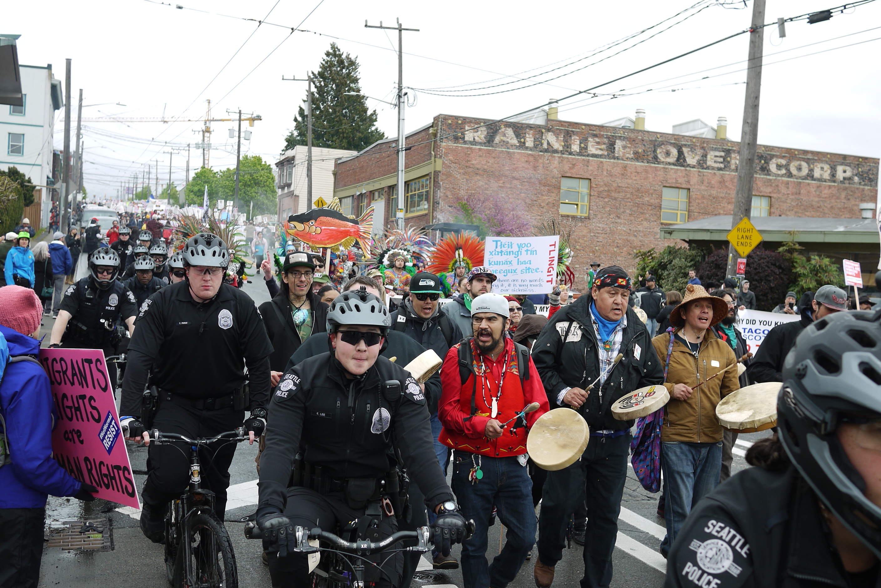 caption: Immigrant rights march heads into downtown Seattle.