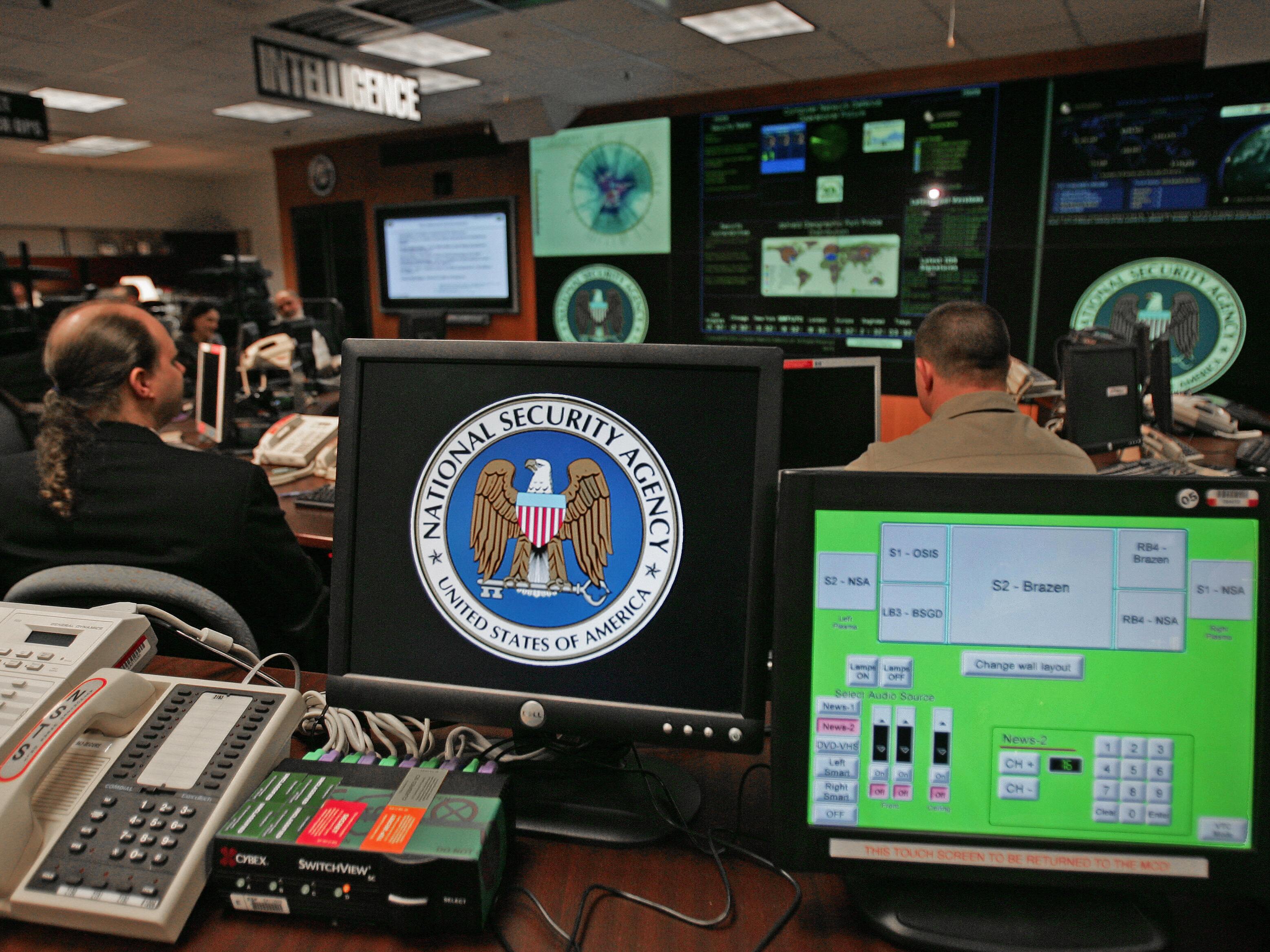 caption: A computer workstation bears the National Security Agency logo inside the Threat Operations Center in the Washington suburb of Fort Meade, Md.