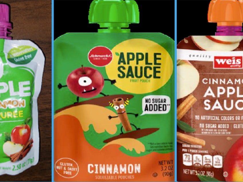 caption: This image provided by the U.S. Food and Drug Administration shows three recalled applesauce products: WanaBana apple cinnamon fruit puree pouches, Schnucks-brand cinnamon-flavored applesauce pouches and variety pack, and Weis-brand cinnamon applesauce pouches.