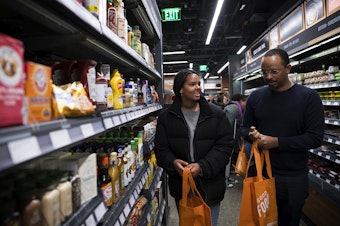 caption: Mary Haddish, 14, left, shops with her father, Daniel Ghebre at Amazon Go on Monday, January 22, 2018, on 7th Ave., in Seattle. 