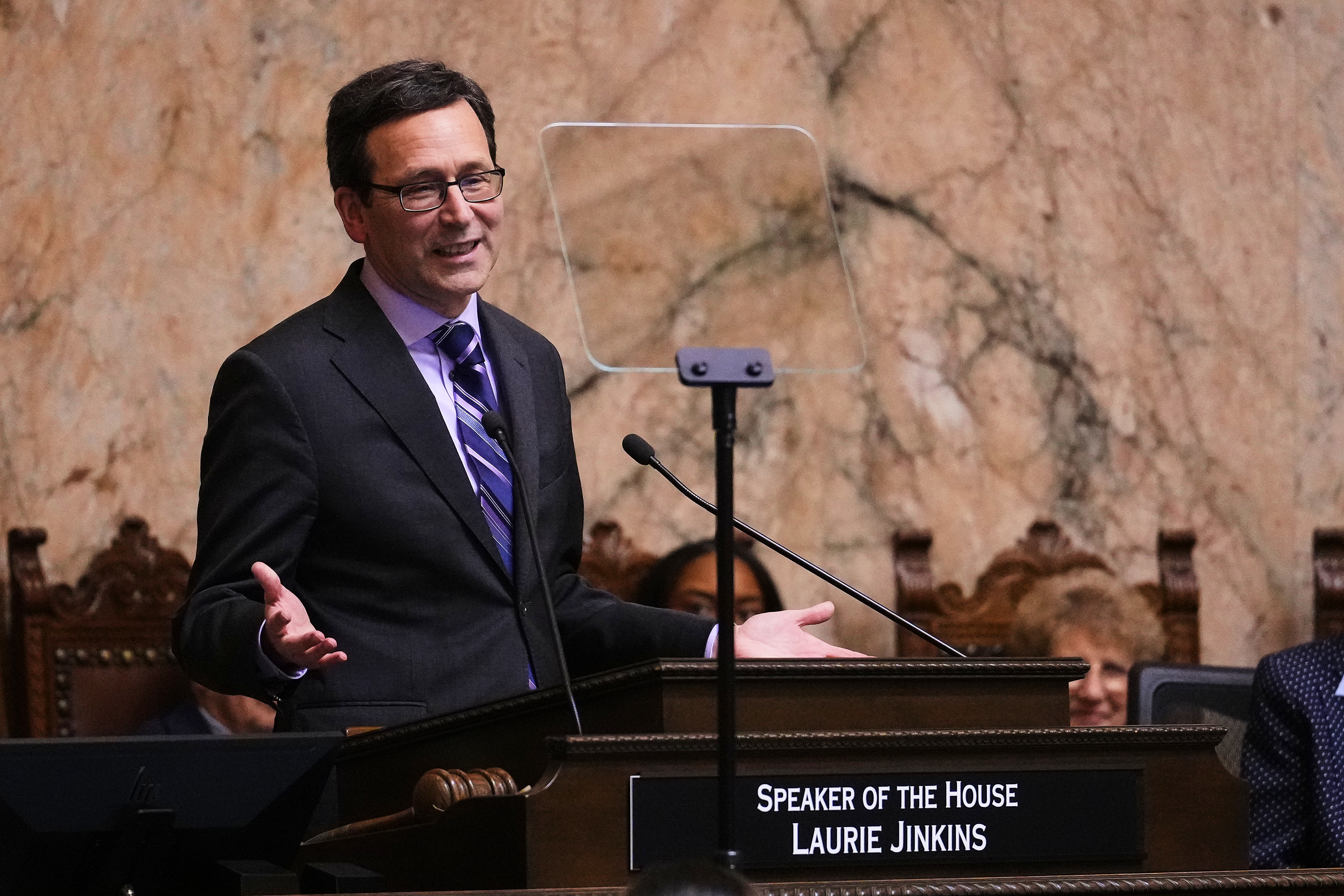 caption: Washington Gov. Bob Ferguson delivers his State of the State address during a joint legislative session at the Washington State Capitol, Tuesday, Jan. 13, 2026, in Olympia, Wash. 