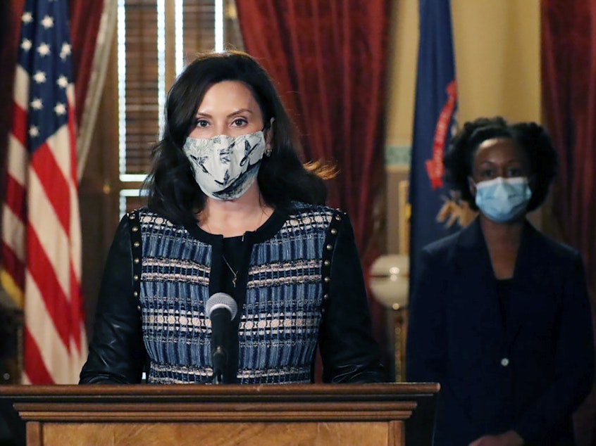 caption: In a photo provided by the Michigan Office of the Governor, Gov. Gretchen Whitmer addresses the state during a speech in Lansing, Mich., Thursday, Nov. 5, 2020. The governor said she sent a letter to Republican lawmakers this week asking them to pass a bill to require residents wear masks in indoor places and crowded outdoor areas. (Michigan Office of the Governor via AP)