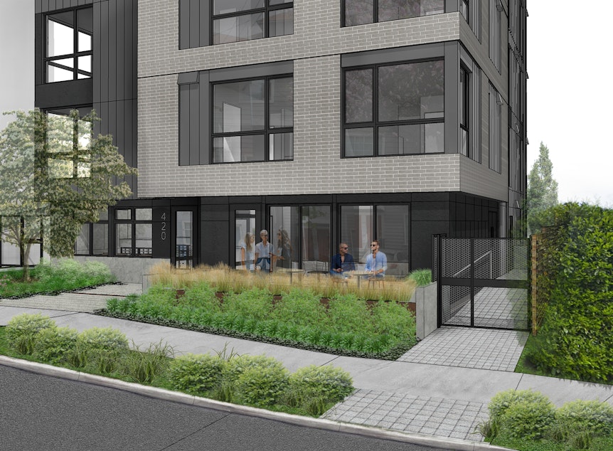 caption: An illustration of the new apartments at John Street and Broadway in Seattle's Capitol Hill neighborhood. The apartments were purchased by the city to house people experiencing homelessness. 